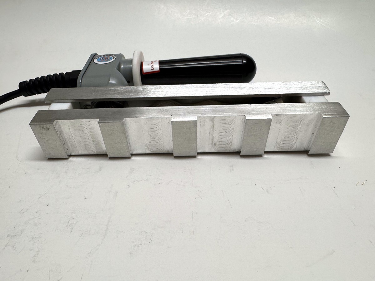 MM 10BK stamp head: the ten individual stamp pads along the bar, black handle iron behind