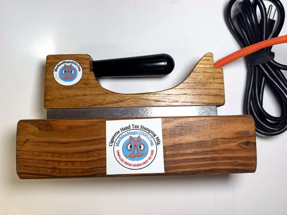MM 11HGCO hot glue carton opener with its flat element-heated bar in its wooden stand