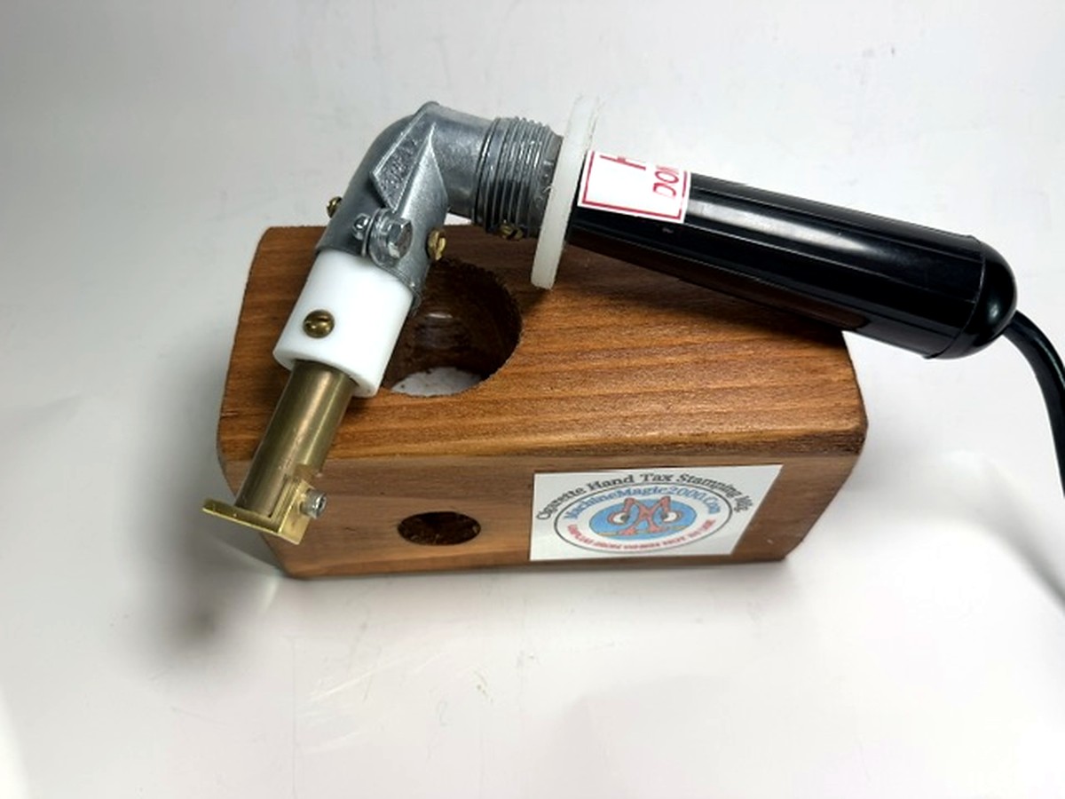 MM 8 black handle single stamp iron in its wooden stand with the brass single-stamp tip